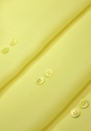 Пуговица рубашечная желтая на четыре прокола 12 мм